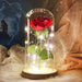 Rose in a glass dome on a wooden base. - Adilsons